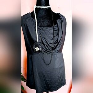 A black blouse by Sharagano, size medium.